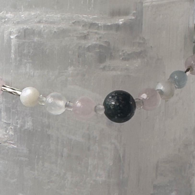 Aquarius birthstone Healing Crystal bracelet for Calm & Anxiety Relief showing Aquamarine, Fluorite, Moonstone, Azurite, Rose Quartz and Selenite
