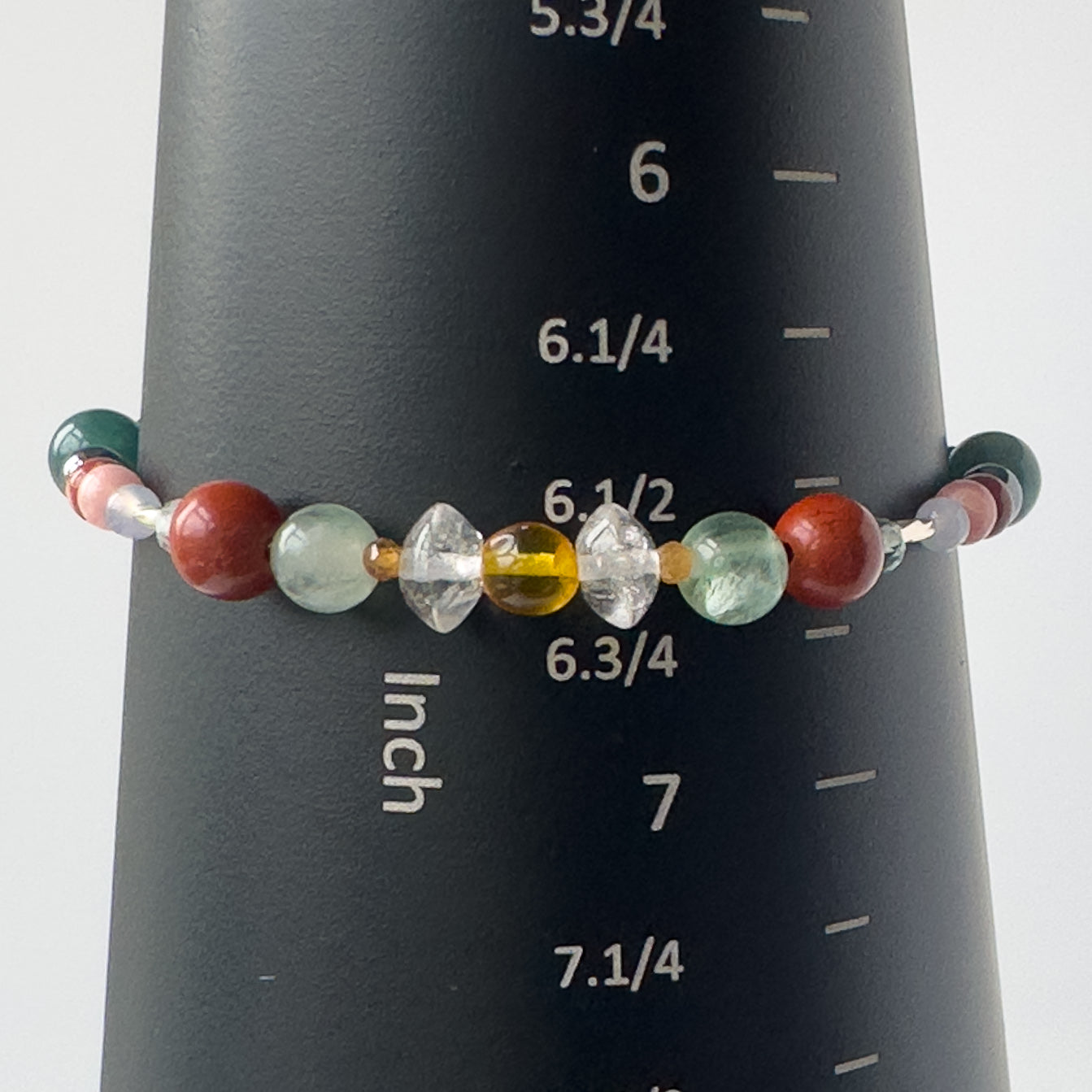 Aquarius Birthstone Healing Crystal bracelet for Confidence and Self-esteem on mandrel showing a size of 6.5 inches