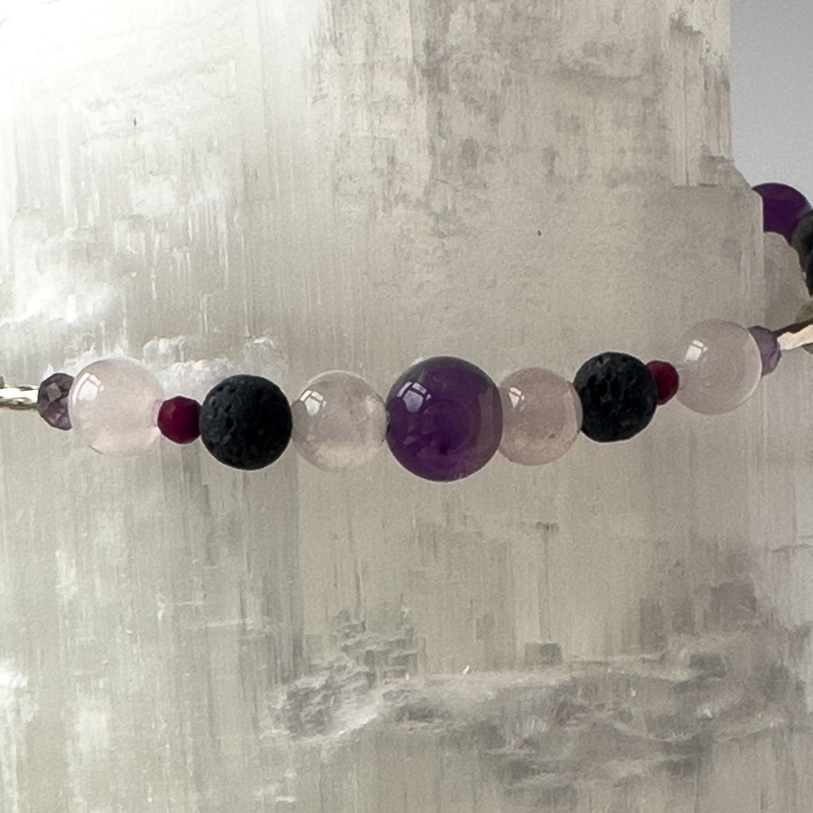 Aquarius Birthstone Healing Crystal bracelet for Grief & Loss support showing Amethyst, Sugilite, Labradorite, Rose Quartz, Selenite, and Lava Stone