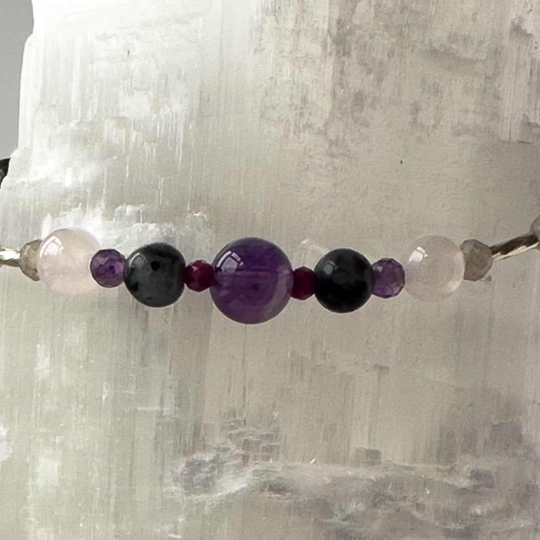 Aquarius Birthstone Healing Crystal bracelet for Grief & Loss support showing Amethyst, Sugilite, Labradorite and Rose Quartz