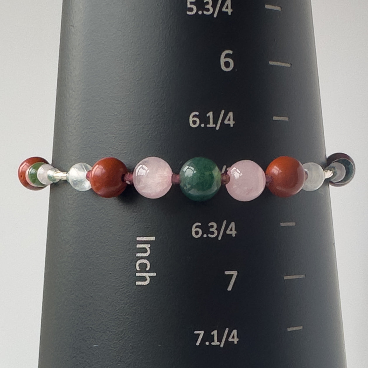 Aquarius Birthstone Healing Crystal bracelet for Love and Compassion on mandrel showing size of 6.5 inches