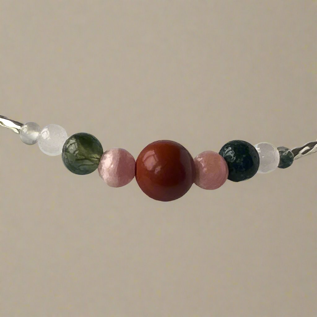 Aquarius birthstone Healing Crystal bracelet for Love and Compassion showing Moss Agate, Red Jasper, Rhodochrosite