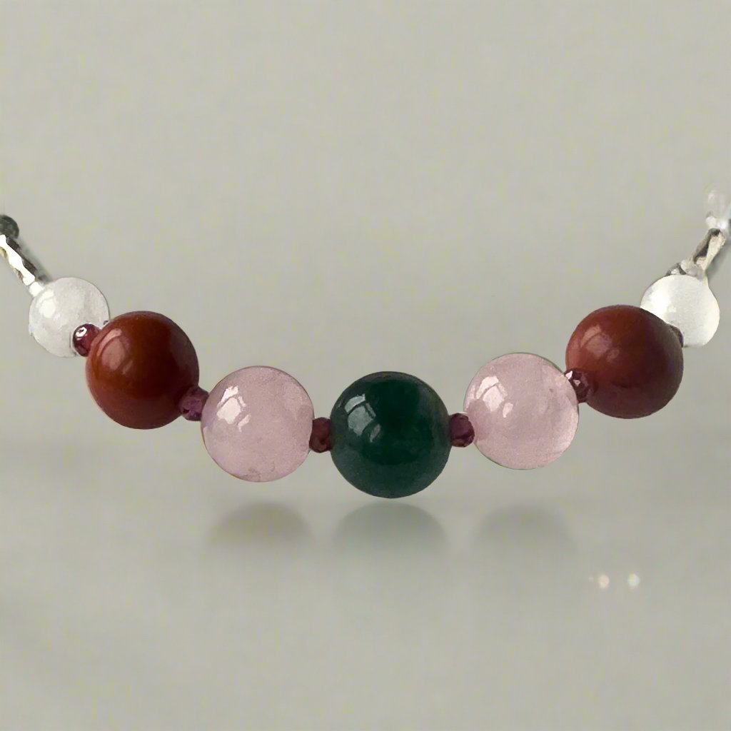Aquarius Birthstone Healing Crystal bracelet for Love and Compassion showing Rose Quartz, Moss Agate, Garnet, Red Jasper and Selenite