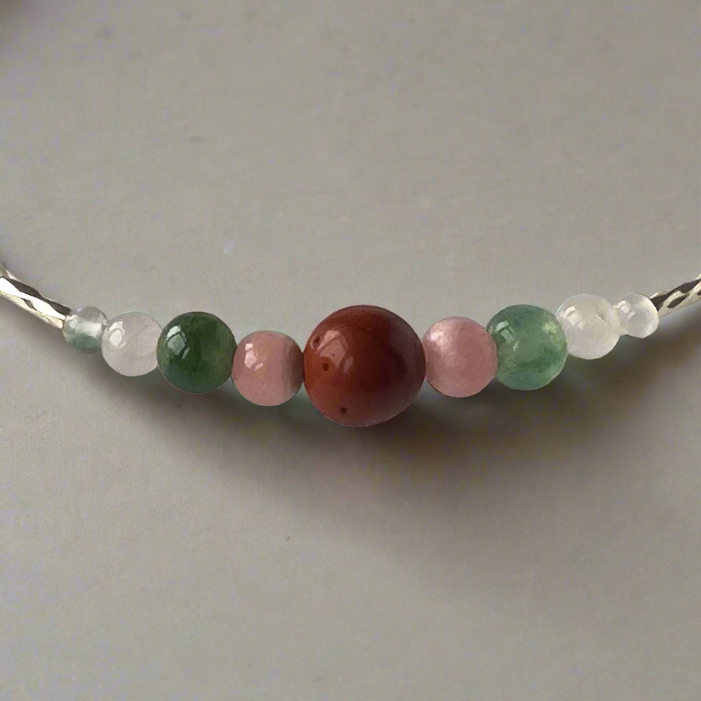 Aquarius Birthstone Healing Crystal bracelet for Love and Compassion showing Rose Quartz, Moss Agate, Red Jasper and Rhodochrosite