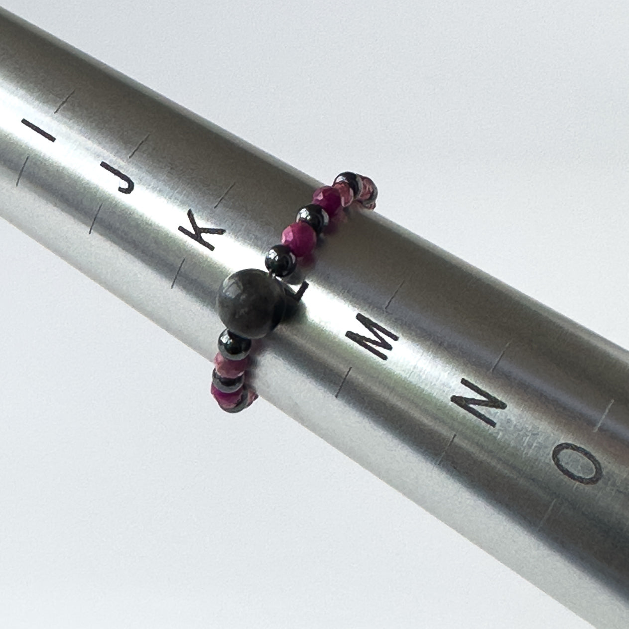 Aquarius Birthstone Healing Crystal ring for Strength and Courage on a mandrel showing a size of L