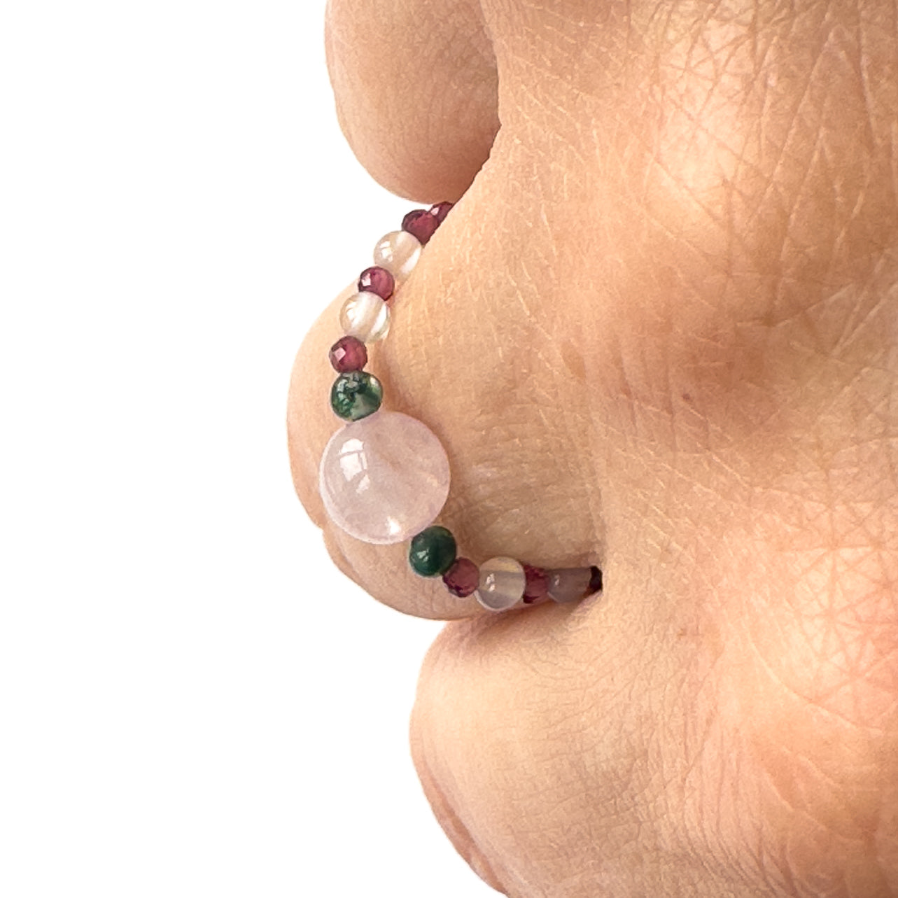 Aquarius birthstone Healing Crystal ring for Love and Compassion on finger (profile view)