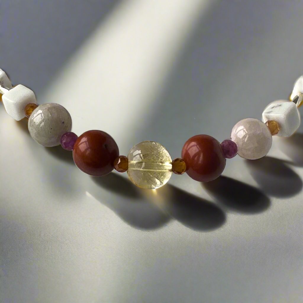 Aries Birthstone Healing Crystal bracelet for Love and Compassion showing Citrine, Garnet, Howlite, Red Jasper, Kunzite and Ruby