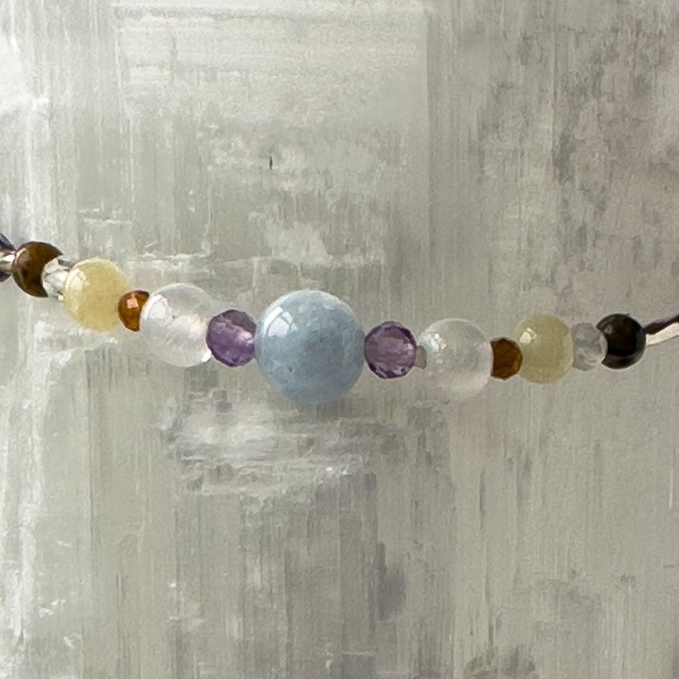 Aries Birthstone Healing Crystal bracelet for Calm & Stress relief showing of Aquamarine, Amethyst, Leopardskin Jasper, Aragonite, Garnet and Selenite