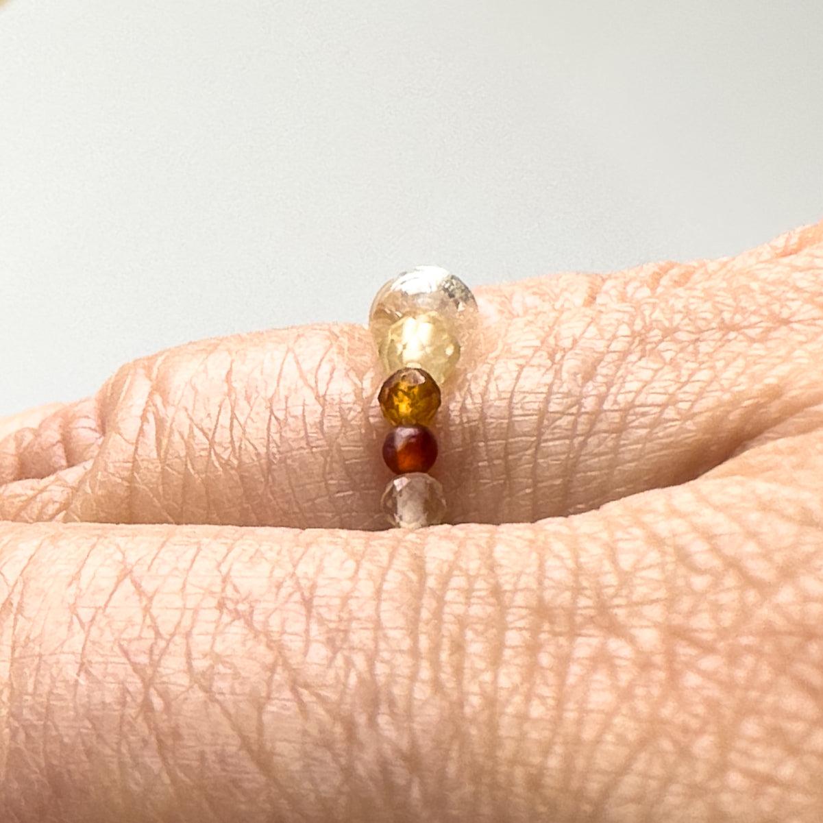 Aries Birthstone Healing Crystal ring for Strength and Courage profile view on a finger