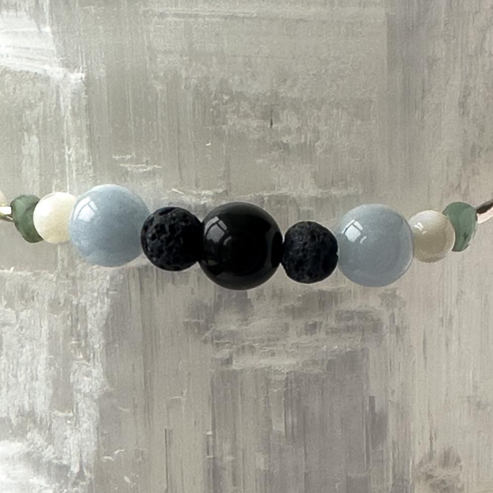 Cancer birthstone Healing Crystal bracelet for Calm & Stress relief showing Moonstone, Emerald, Aquamarine, Obsidian and Lava Stone