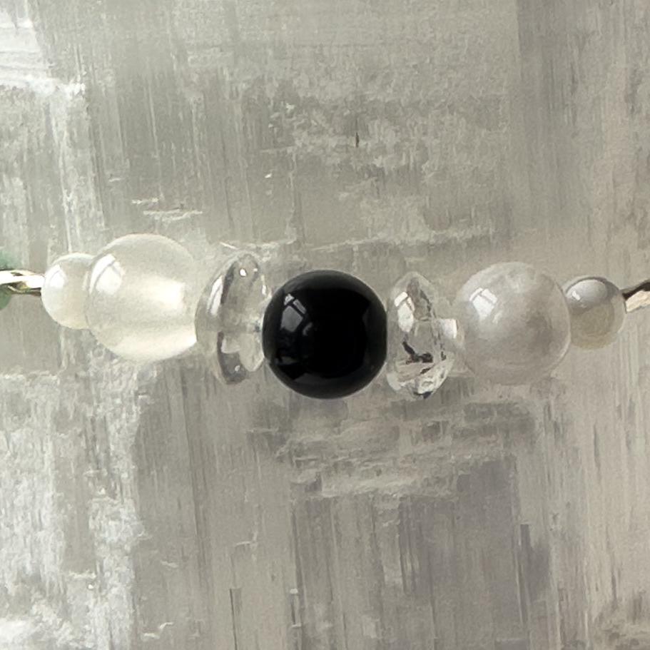 Cancer birthstone Healing Crystal bracelet for Calm & Stress relief showing Moonstone, Obsidian, Selenite and Clear Quartz