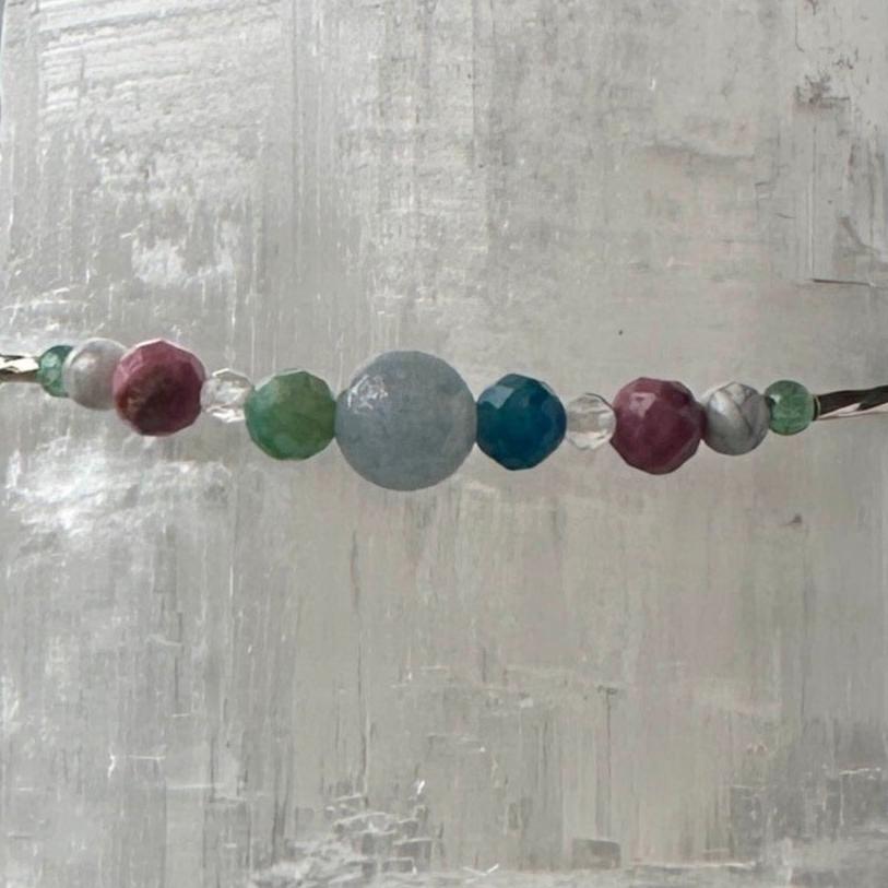 Cancer Birthstone Healing Crystal bracelet for Calm & Anxiety Relief showing Chrysocolla, Rhodonite, Aquamarine, Howlite, and Clear Quartz