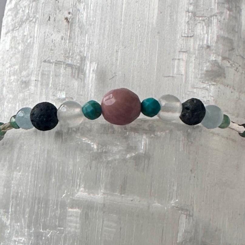 Cancer Birthstone Healing Crystal bracelet for Calm & Anxiety Relief showing Chrysocolla, Rhodonite, Turquoise, Aquamarine, Selenite and Lava Stone