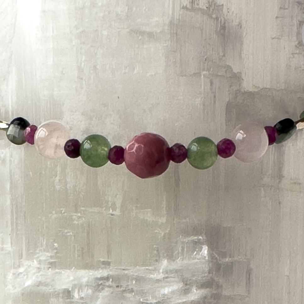 Cancer Birthstone Healing Crystal bracelet for Grief & Loss support showing Ruby, Rhodonite, Rose Quartz, Chalcedony and Emerald
