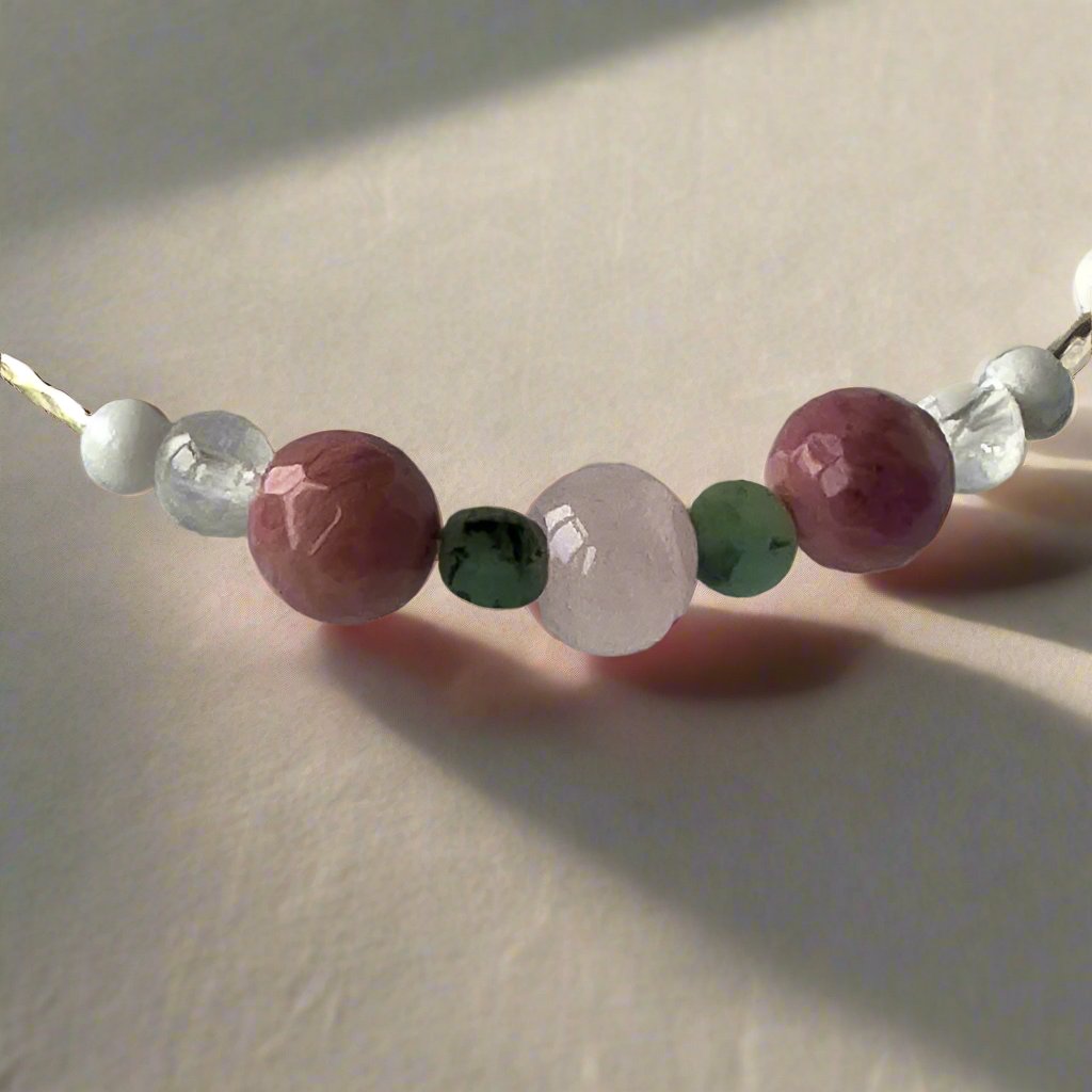 Cancer birthstone Healing Crystal bracelet for Love and Compassion showing Rose Quartz, Emerald, Howlite, Rhodonite, Selenite and Clear Quartz