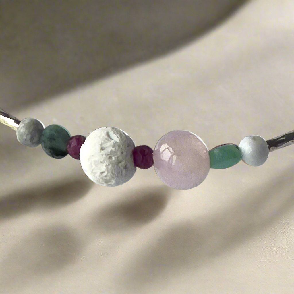 Cancer birthstone Healing Crystal bracelet for Love and Compassion showing Rose Quartz, Emerald, Howlite, Ruby and Lava Stone