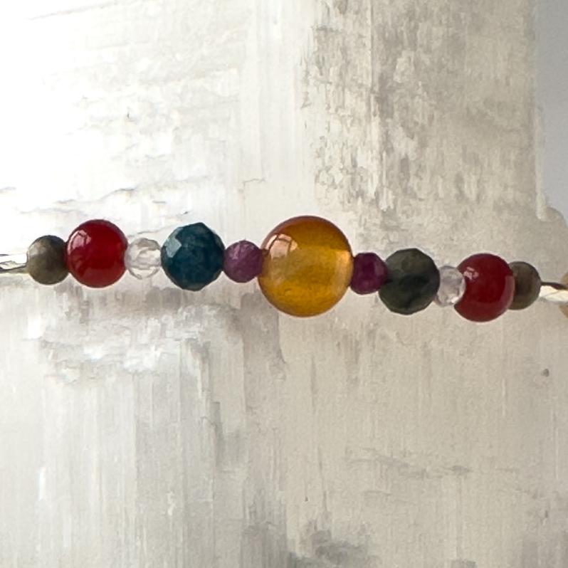 Cancer birthstone  Healing Crystal bracelet for Determination & Willpower showing Carnelian, Ruby, Chrysocolla, Leopardskin Jasper, and Clear Quartz