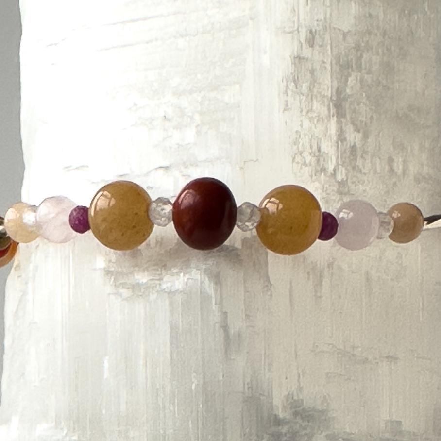 Cancer Birthstone Healing Crystal bracelet for Determination & Willpower showing Red Jasper, Ruby, Carnelian, Rose Quartz, Sunstone and  Clear Quartz