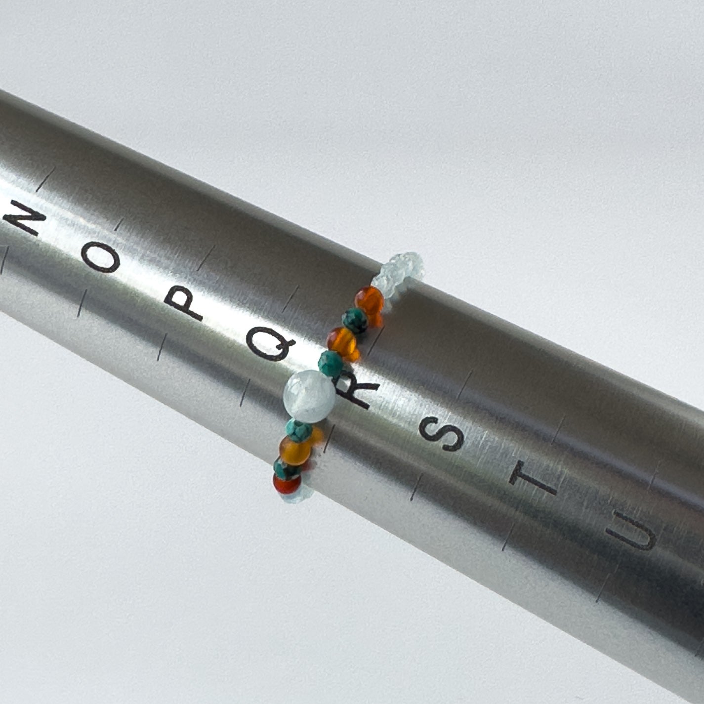 Cancer Birthstone Healing Crystal ring for Strength and Courage on mandrel showing size as R