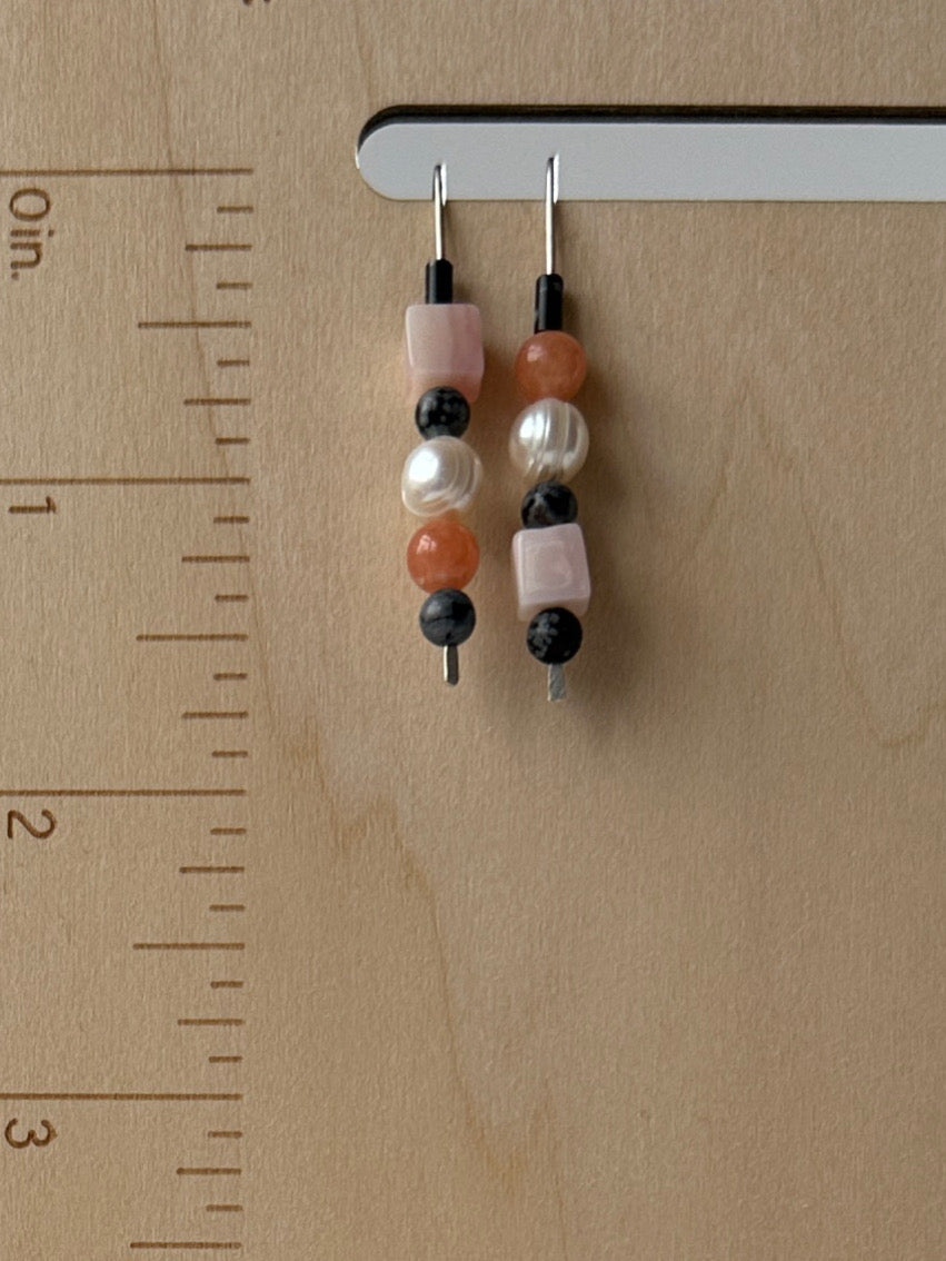 Stress Healing crystal earrings with Cancer birthstone crystals on stand showing size as 1.75 inches.