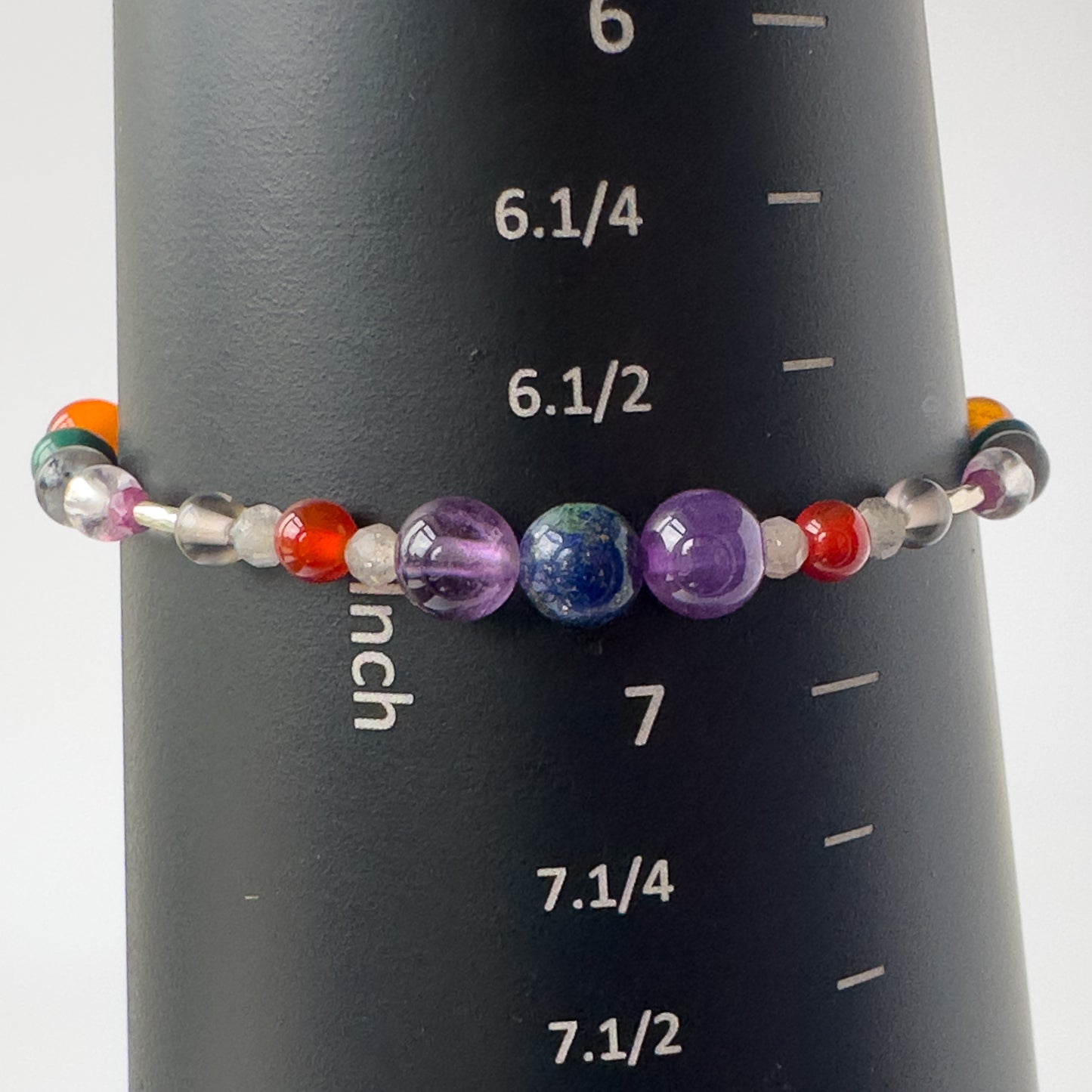 Capricorn birthstone Healing Crystal bracelet for Grief & Loss support on mandrel showing size of 6.5 inches