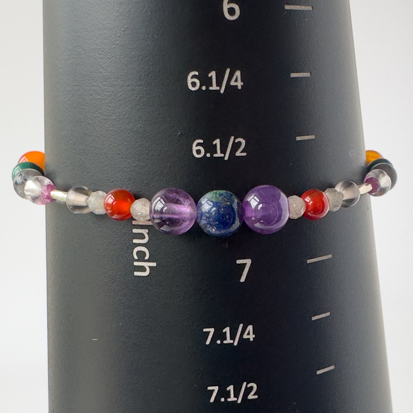 Capricorn birthstone Healing Crystal bracelet for Grief & Loss support on mandrel showing size of 6.5 inches