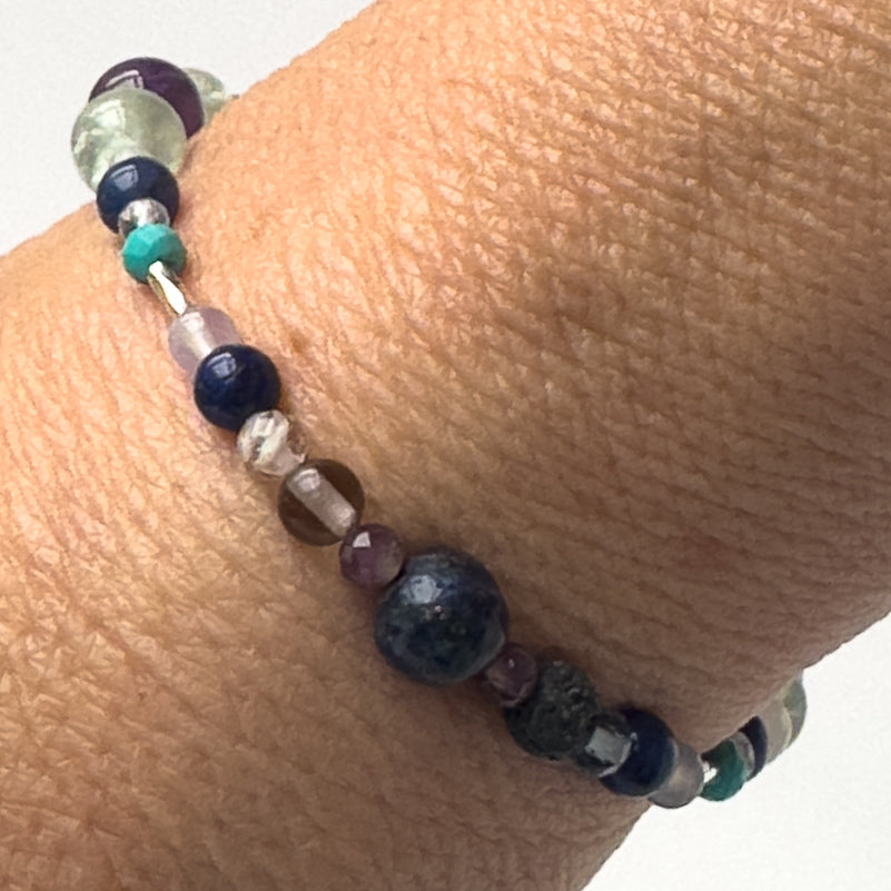 Capricorn Birthstone Healing Crystal bracelet for Calm & Anxiety Relief on a wrist showing Turquoise, Smoky Quartz, Amethyst, Lapis Lazuli, Azurite and Sodalite