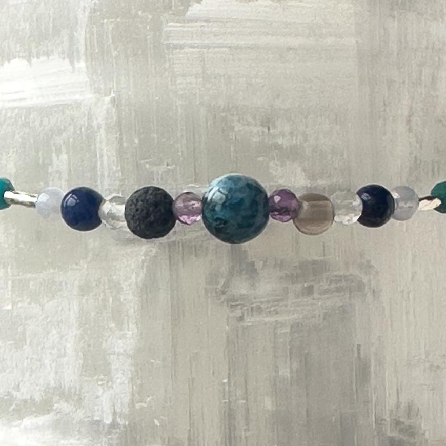 Capricorn Birthstone Healing Crystal bracelet for Calm & Anxiety Relief showing Blue Lace Agate, Smoky Quartz, Amethyst, Azurite, Sodalite, Clear Quartz and Lava Stone