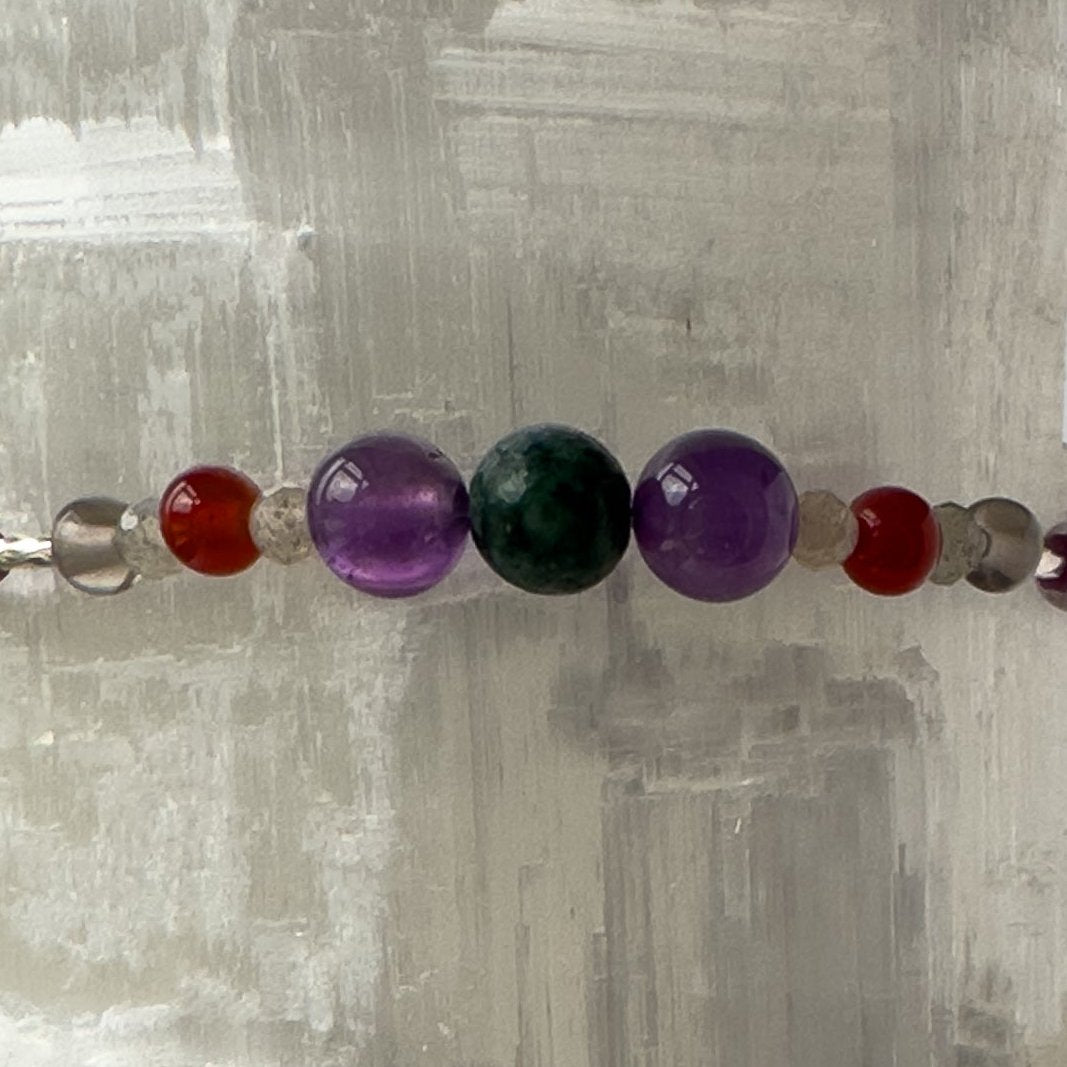 Capricorn Birthstone Healing Crystal bracelet for Grief & Loss support showing Smoky Quartz, Labradorite, Amethyst, Ruby and Azurite