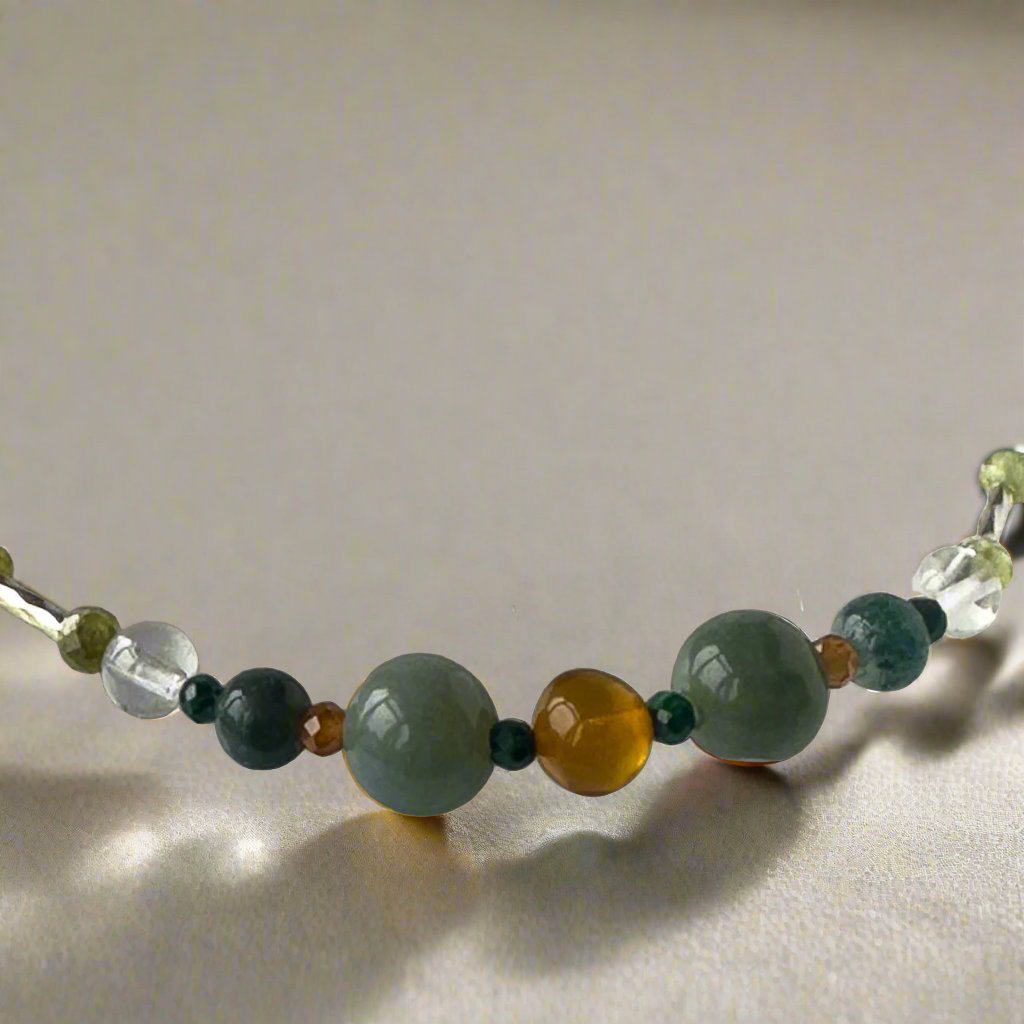 Capricorn Birthstone Healing Crystal bracelet for Love and Compassion  showing Amber, Moss Agate, Azurite, Garnet, Malachite and Clear Quartz