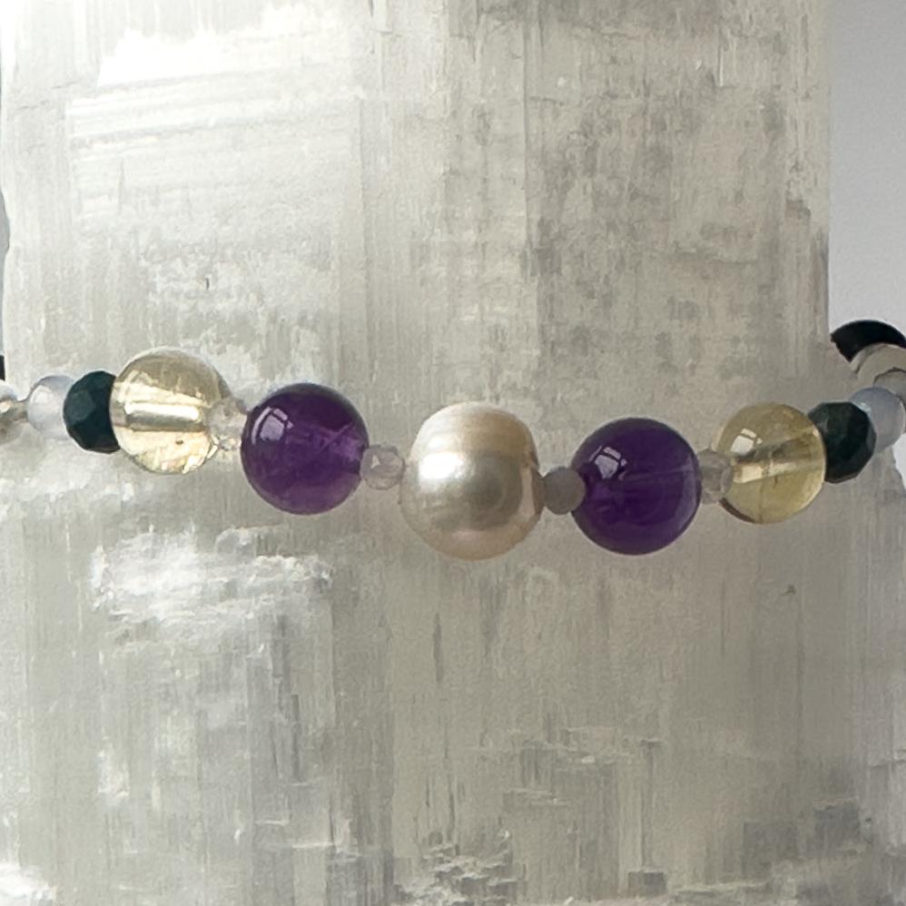 Gemini Birthstone Healing Crystal bracelet for Calm & Anxiety Relief showing Blue Lace Agate, Chrysocolla, Pearl, Citrine, Amethyst and Lava Stone