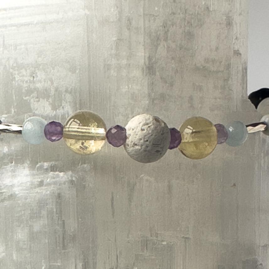 Gemini Birthstone Healing Crystal bracelet for Calm & Anxiety Relief showing Blue Lace Agate, Citrine, Amethyst and Lava Stone