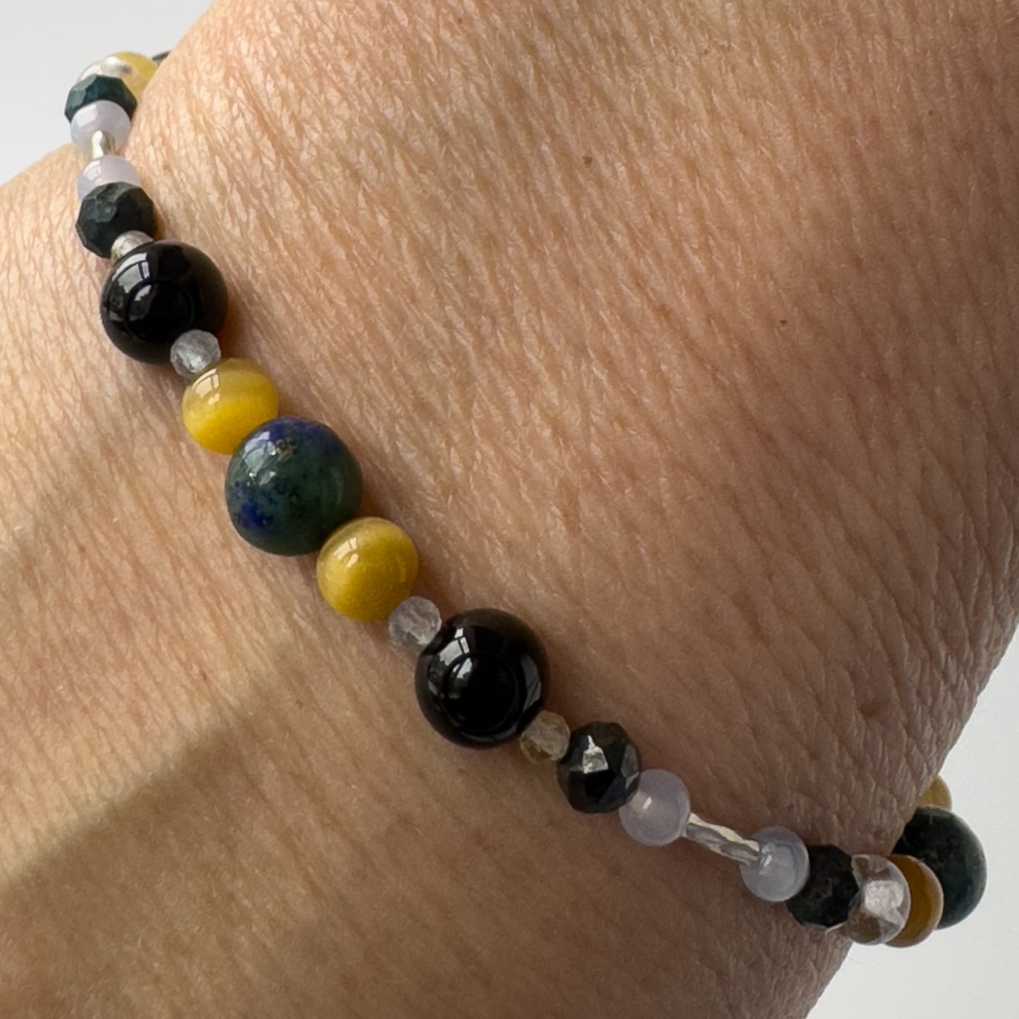 Gemini Healing Crystal bracelet for Confidence Showing Yellow Tiger’s Eye, Blue Lace Agate, Tourmaline, Chrysocolla and Citrine on a wrist