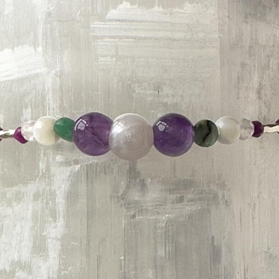 Gemini Birthstone Healing Crystal bracelet for Grief & Loss support showing Emerald, Moonstone, Amethyst and Sugilite