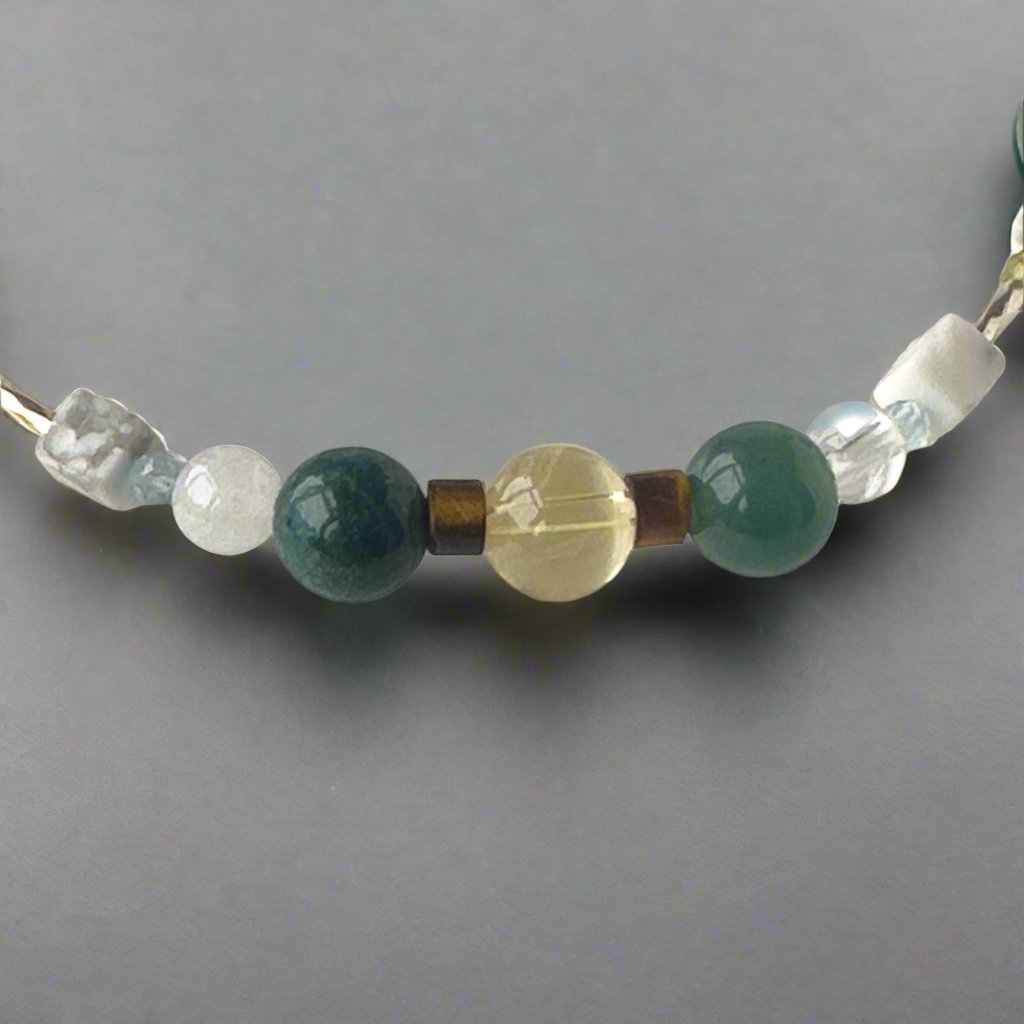 Gemini birthstone Healing Crystal bracelet for Love and Compassion showing Citrine, Moss Agate, Howlite, Tiger’s Eye, Topaz, Selenite and Clear Quartz