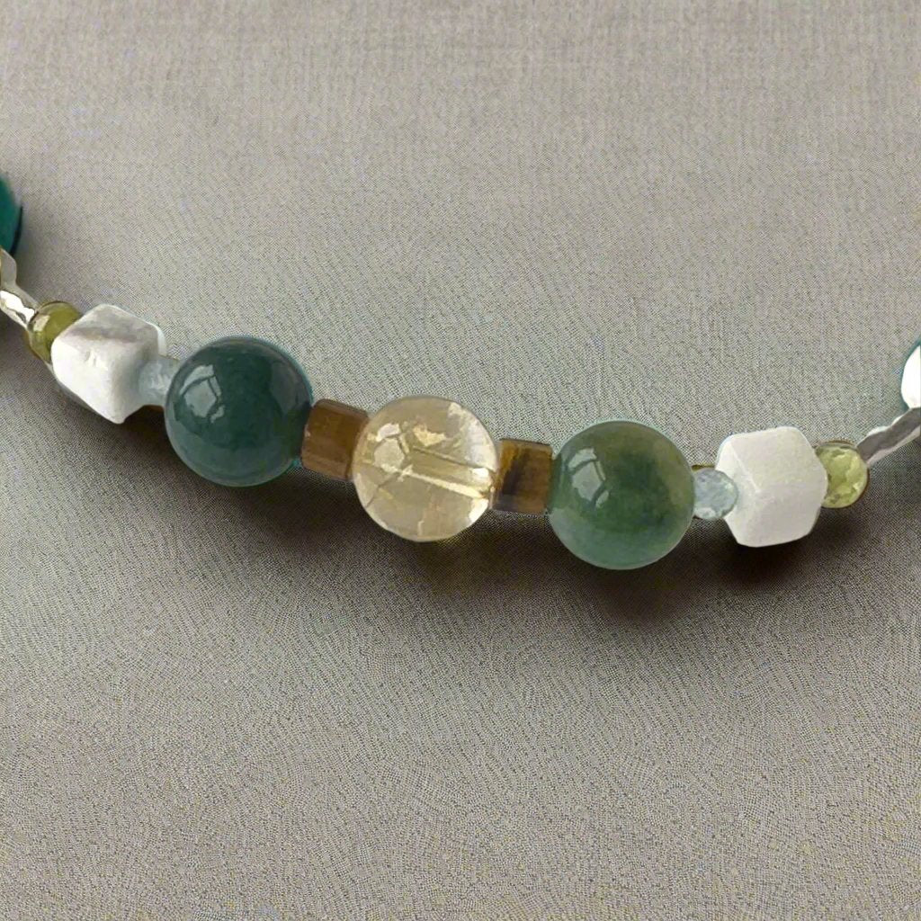 Gemini Birthstone Healing Crystal bracelet for Love and Compassion showing Citrine, Peridot, Moss Agate, Howlite, Tiger’s Eye and Topaz