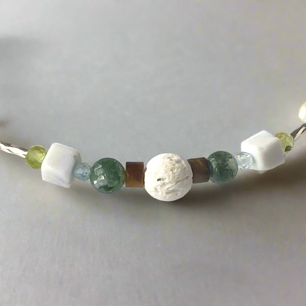 Gemini Birthstone Healing Crystal bracelet for Love and Compassion showing Peridot, Moss Agate, Howlite, Tiger’s Eye, Topaz and Lava Stone