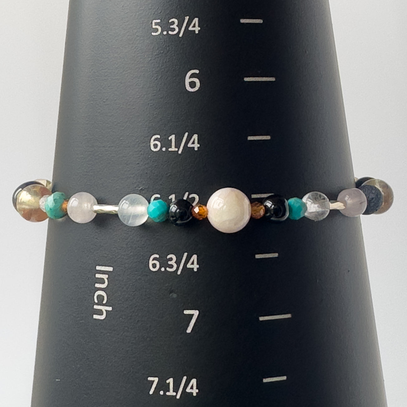 Leo Birthstone Healing Crystal bracelet for Calm & Anxiety Relief on a mandrel showing size as 6.5 inches
