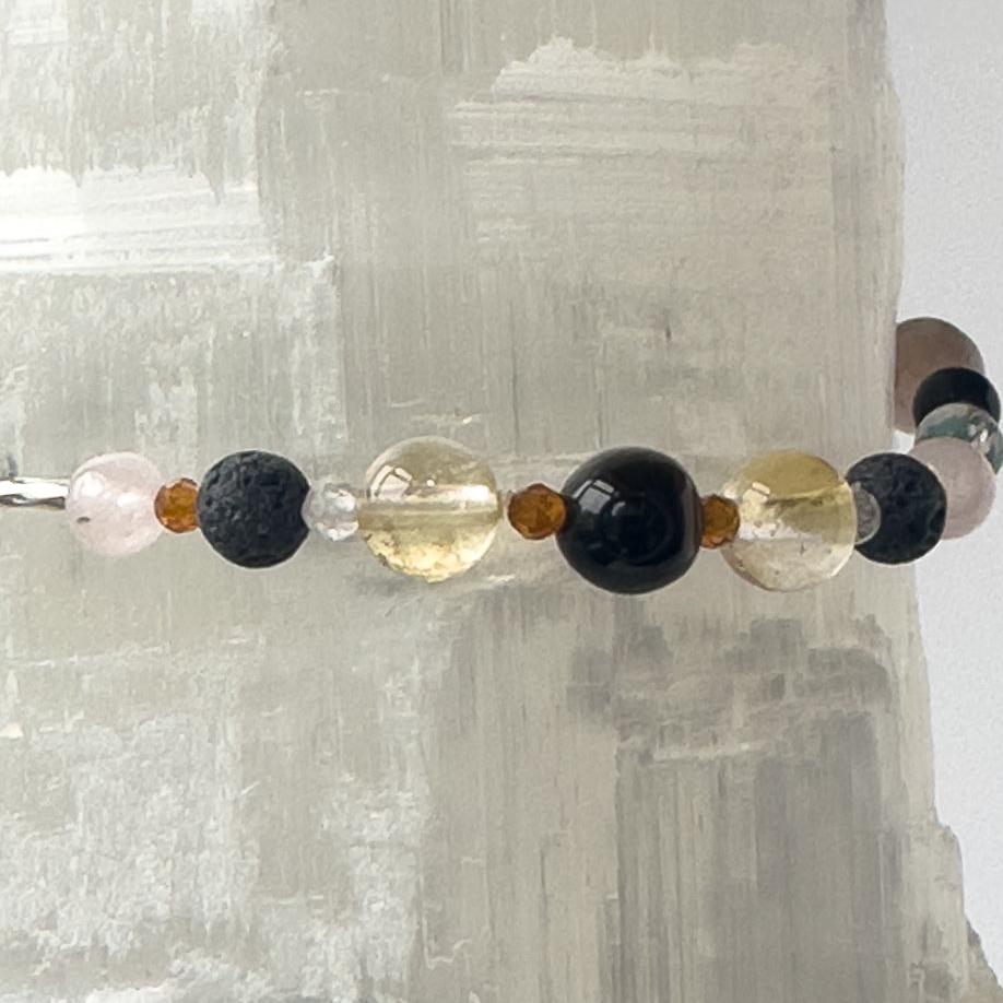 Leo Birthstone Healing Crystal bracelet for Calm & Anxiety Relief showing Blue Tiger’s Eye, Rose Quartz, Citrine, Garnet and Lava Stone