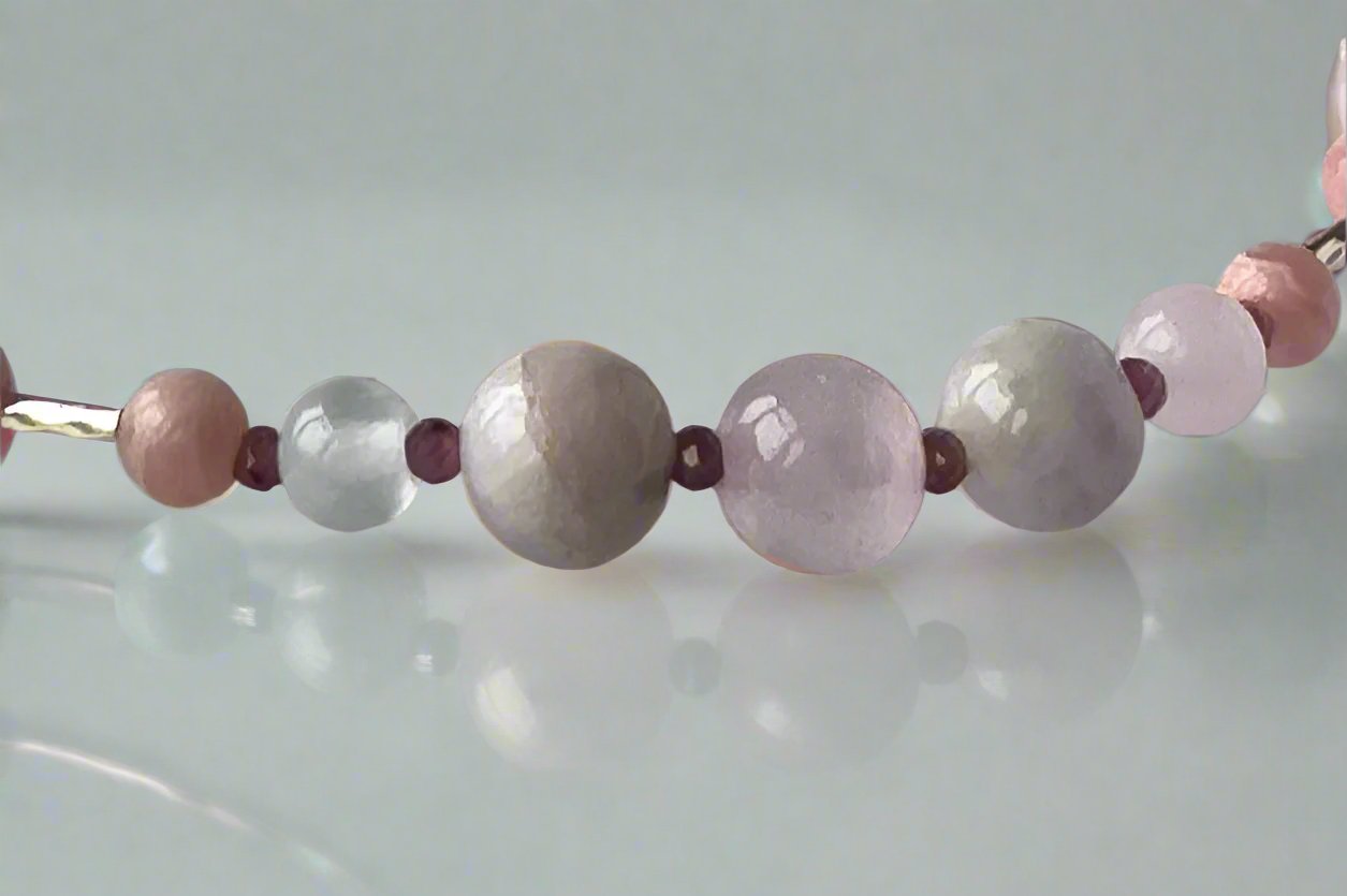 Leo Birthstone Healing Crystal bracelet for Love and Compassion showing Rose Quartz, Garnet, Kunzite, Rhodochrosite, Ruby and Selenite
