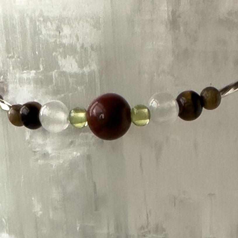 Leo Birthstone Healing Crystal bracelet for Calm & Stress relief showing Yellow Tiger’s Eye, Peridot, Jasper and Selenite