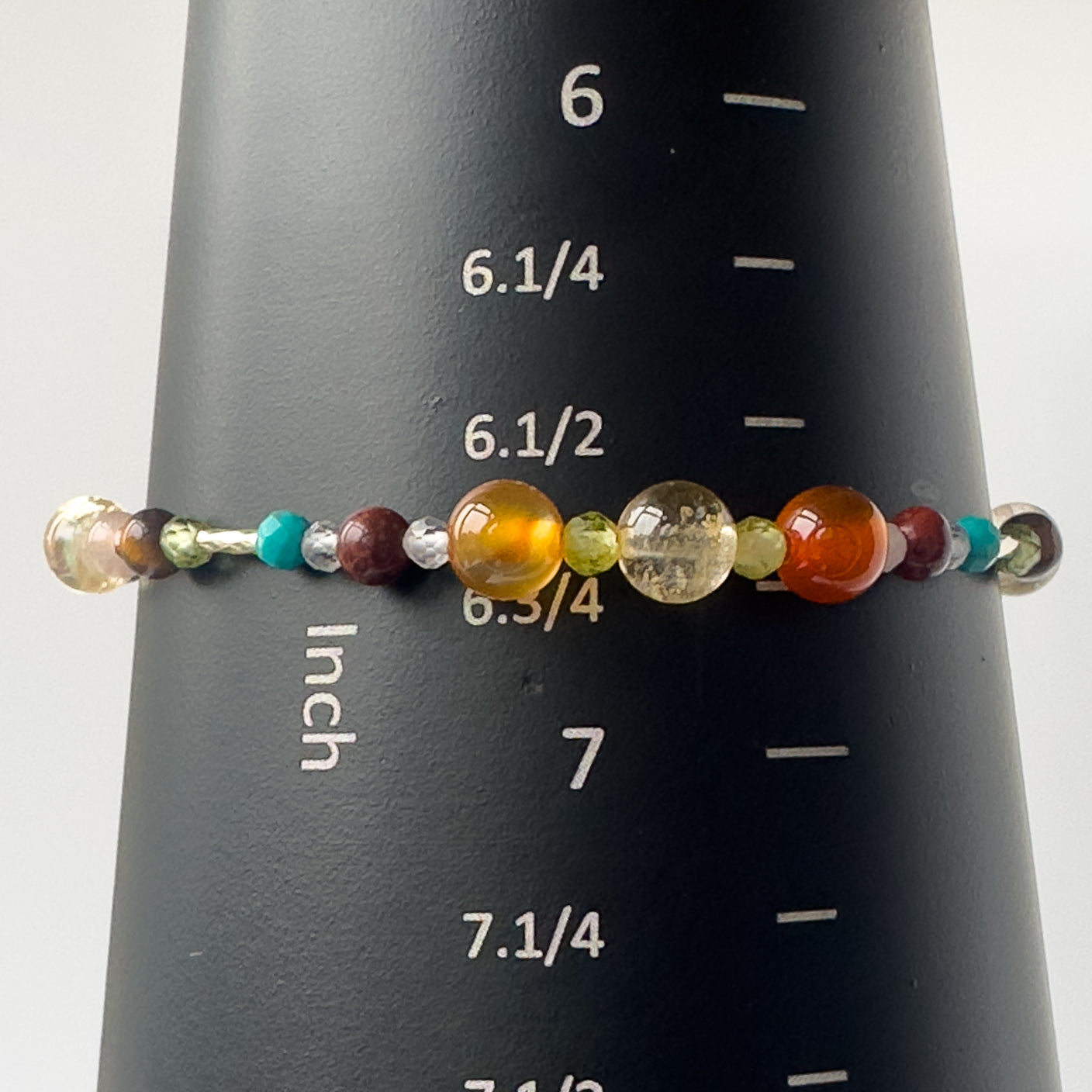 Leo Birthstone Healing Crystal bracelet for Determination & Willpower on mandrel showing size of approx 6.75 inches