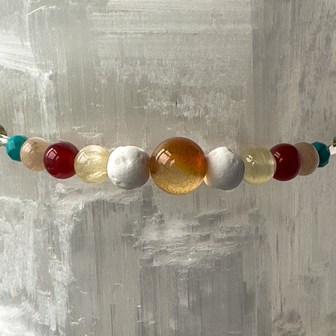Leo Birthstone Healing Crystal bracelet for Determination & Willpower showing Carnelian, Citrine, Sunstone, Turquoise and Lava Stone