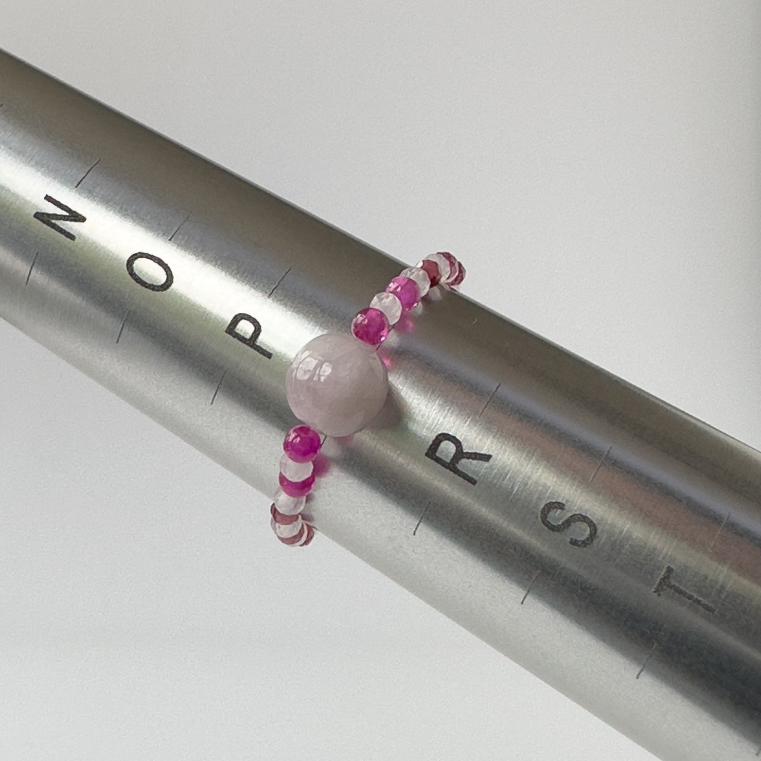 Leo Birthstone Healing Crystal ring for Love and Compassion on mandrel showing size as Q