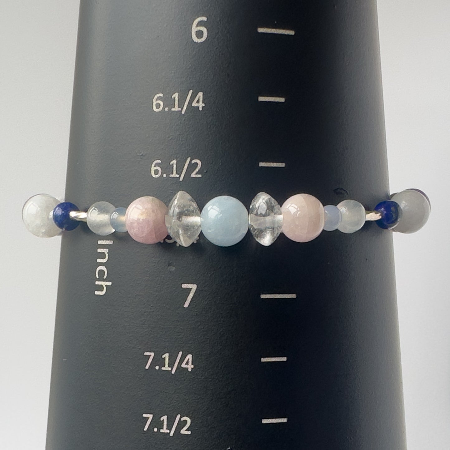 Libra Birthstone Healing Crystal bracelet for Calm & Anxiety Relief on a mandrel showing size of 6.75 inches