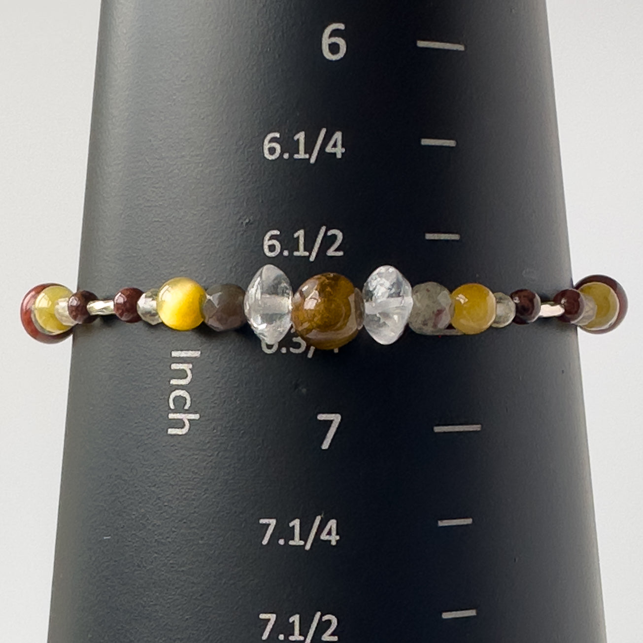 Libra Birthstone Healing Crystal bracelet for Confidence and Self-esteem on a mandrel showing a size of 6.75 inches
