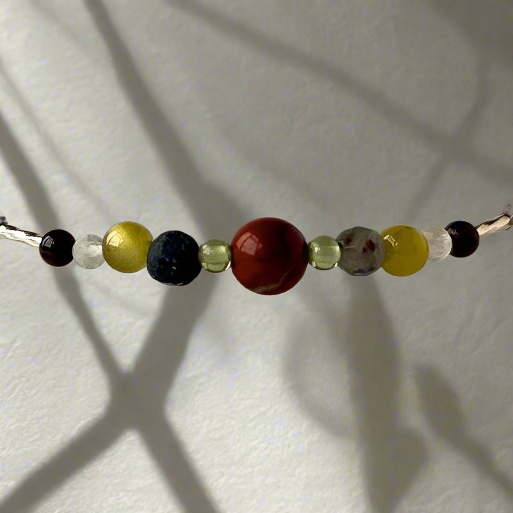 Libra Birthstone Healing Crystal bracelet for Confidence and Self-esteem showing Mahogany Obsidian, Peridot, Lava Stone and Bloodstone