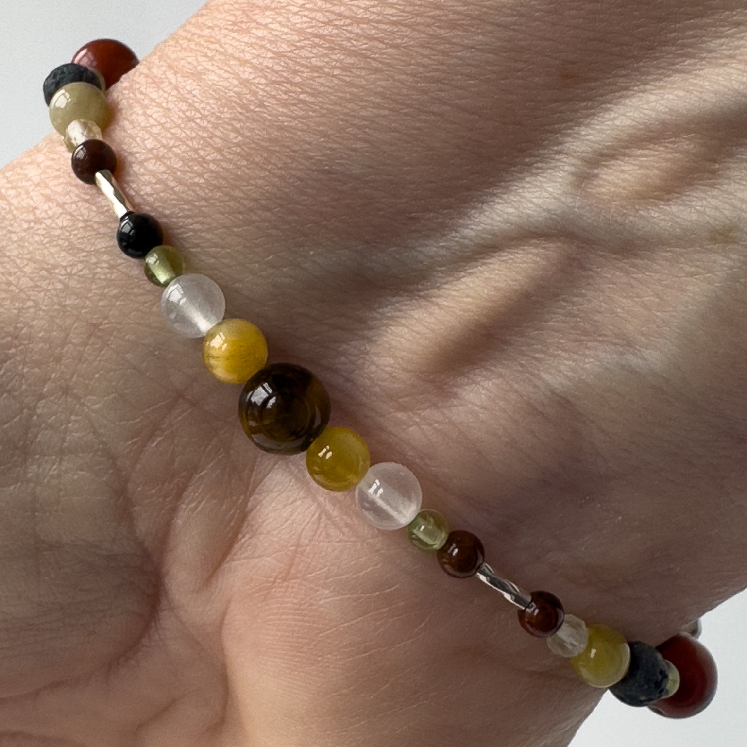 Libra Birthstone Healing Crystal bracelet for Confidence and Self-esteem showing Peridot, Yellow Tiger’s Eye and Mahogany Obsidian
