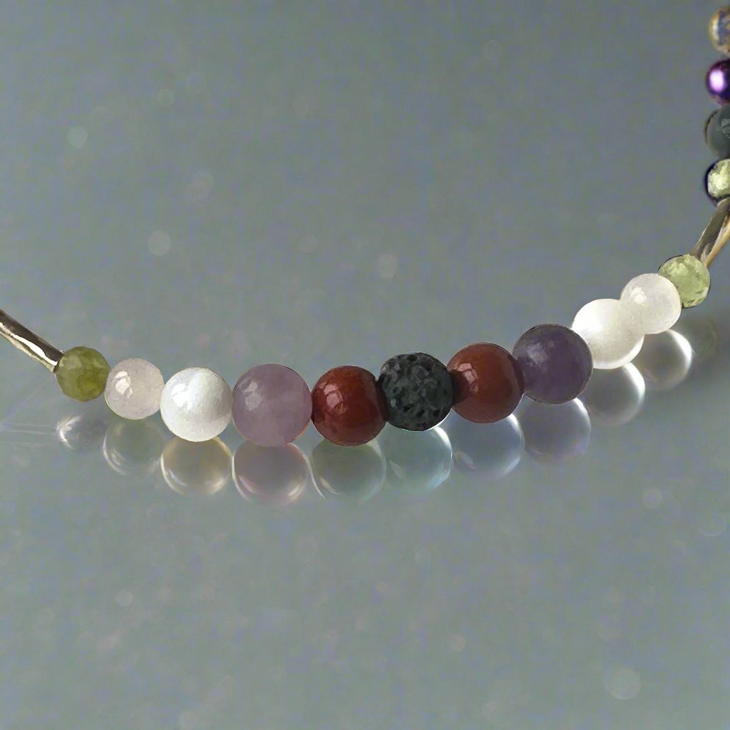 Libra birthstone Healing Crystal bracelet for Calm & Stress relief showing Peridot, Rose Quartz, Lepidolite, Moonstone, Jasper and Lava Stone