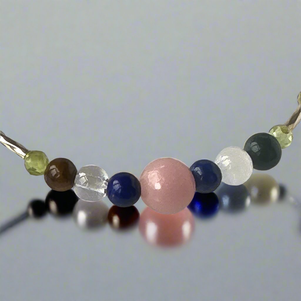 Libra Birthstone Healing Crystal bracelet for Calm & Stress relief showing Pink Opal, Peridot, Lapis Lazuli, Yellow Tiger’s Eye, Selenite and Clear Quartz